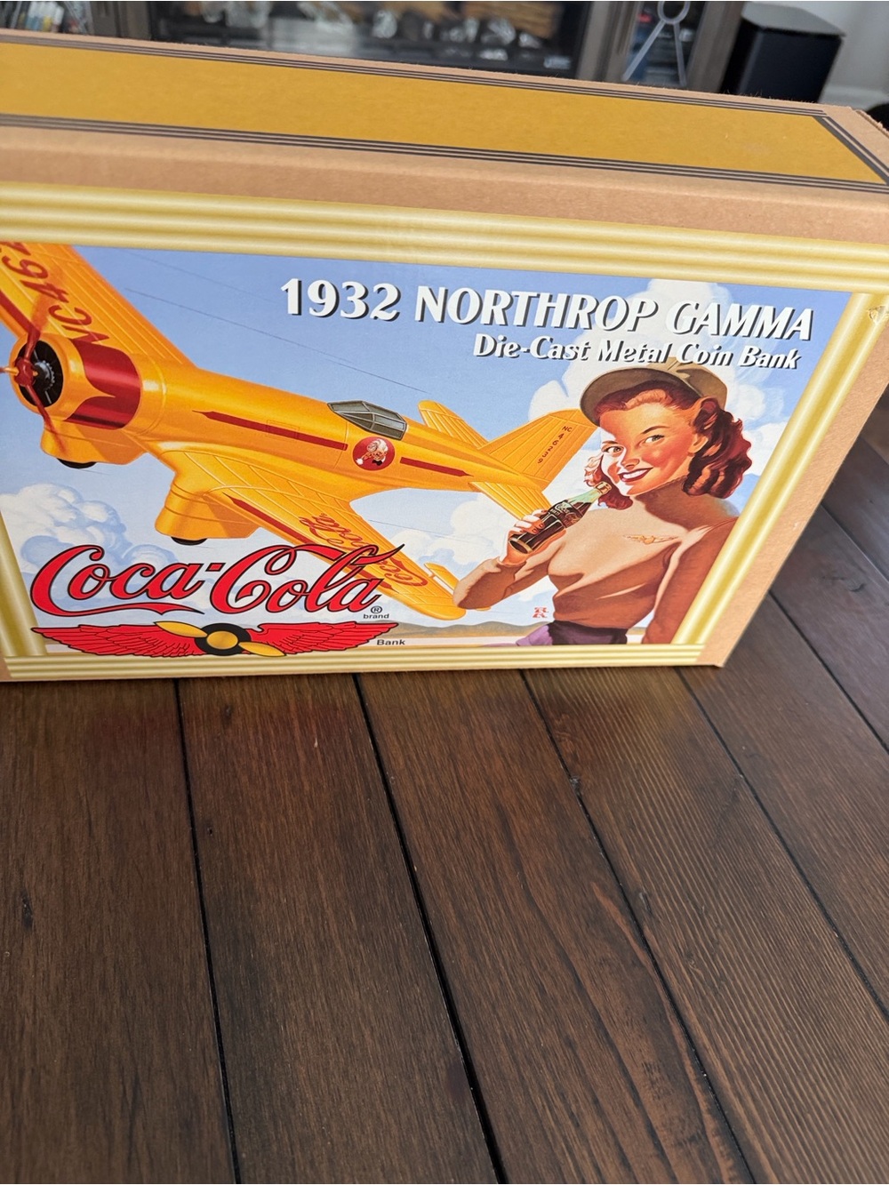New in box (NIB) 1995 Coca-Cola 1932 Northrop Gamma Diecast Airplane Coin Bank.